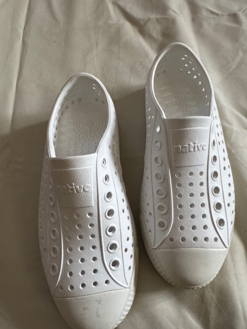 Native Slip-On Perforated Sneakers in White woman’s 5